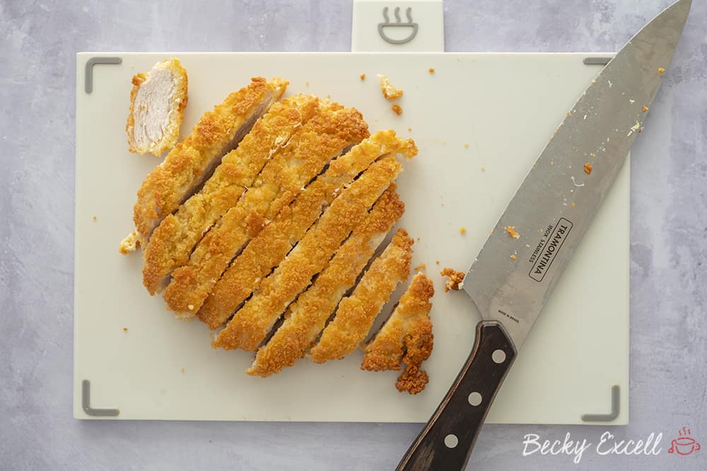 Gluten-free Katsu chicken in golden breadcrumbs, chopped and ready to serve