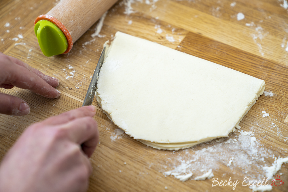 Fold over your dough and trip off any excess if you like. This helps to get a nice, neat gluten free calzone shape.