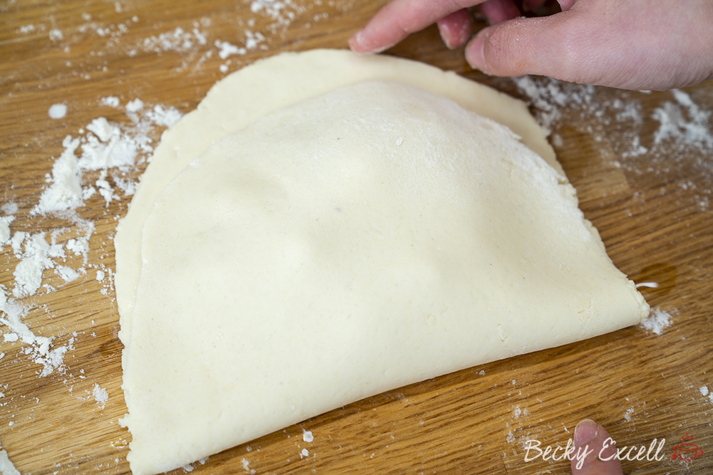 Leave about 1cm of extra dough around the edges like so