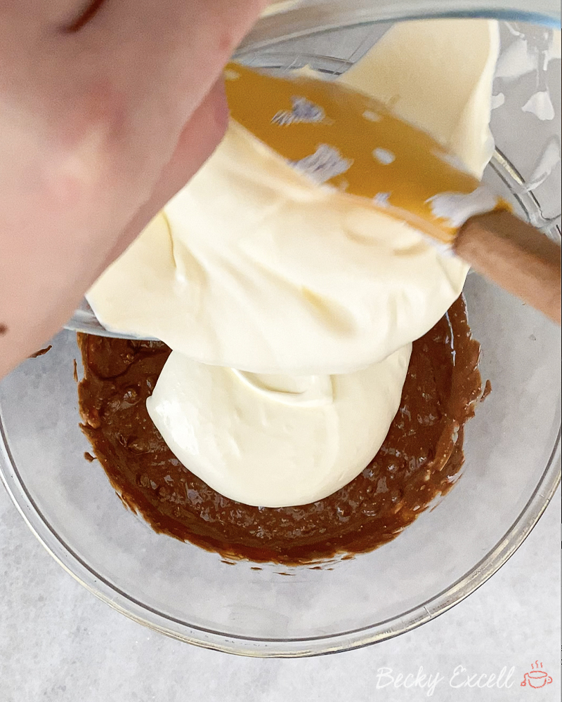 Gluten-free Chocolate Orange Toblerone Tart Recipe: Add your cream mixture to your melted chocolate.