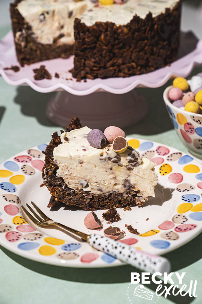Slice of Gluten-free chocolate cornflake Mini Egg cheesecake close up