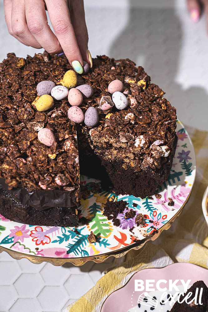 Topping my Gluten-free mini egg crunch cake with Mini Eggs