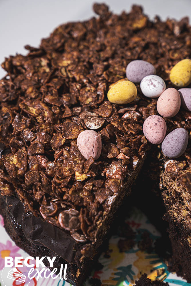 Showing off the crunchy chocolate cornflake layer on top of the finished cake