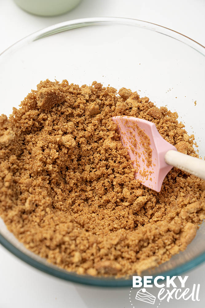 Crushed gluten-free digestive biscuits mixed with melted butter