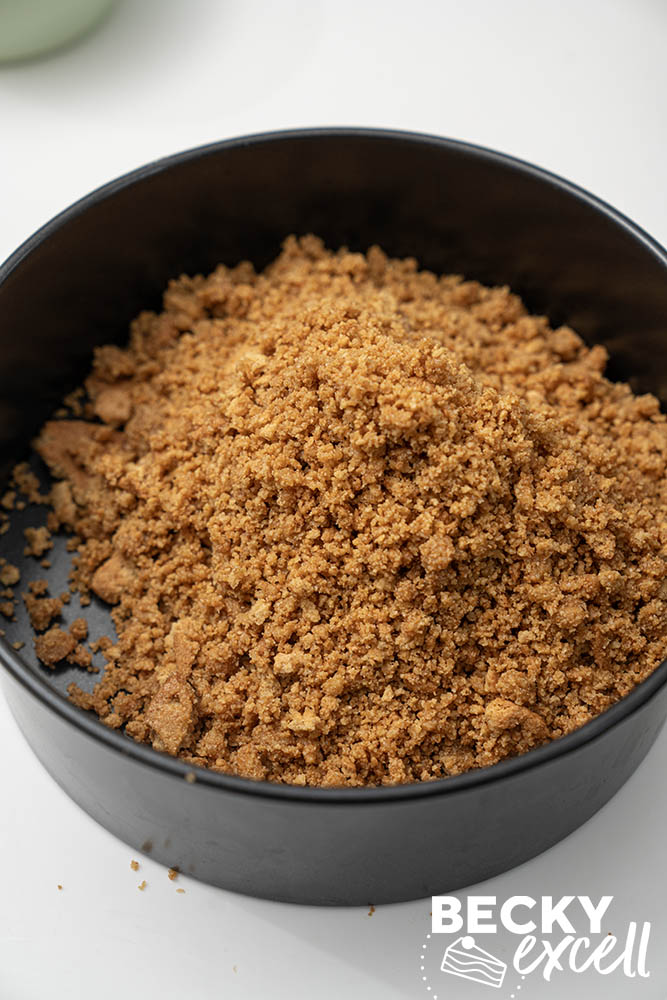The prepared gluten-free digestive biscuit base in the 20cm loose-bottomed tin.
