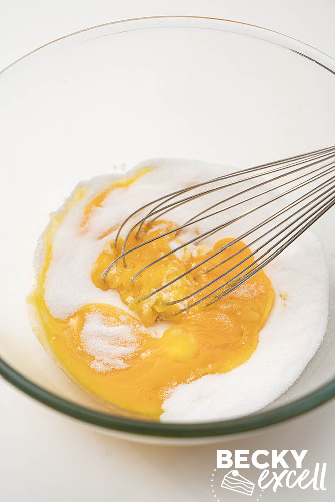 Whisking the egg yolks and caster sugar for the custard base