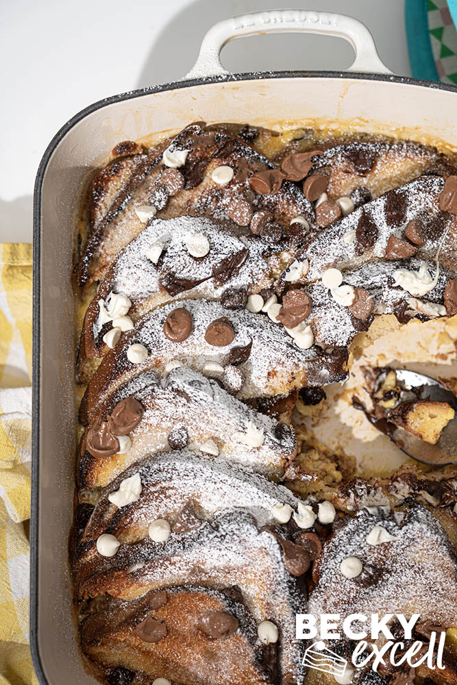 Layers of gluten-free bread soaked in rich vanilla custard (triple chocolate variation)