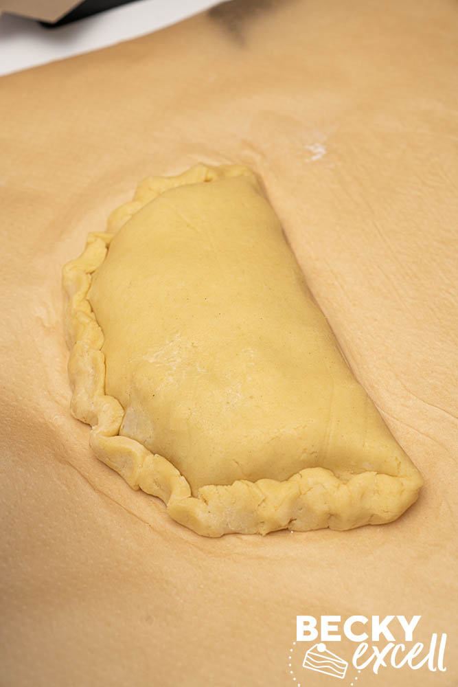 The folded and crimped pasty is nearly finished and ready for egg wash and a small steam vent.