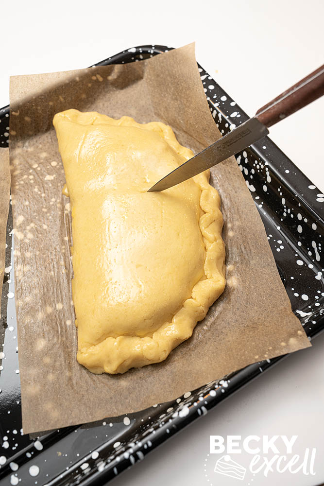 Use a small sharp knife to make the steam vent.