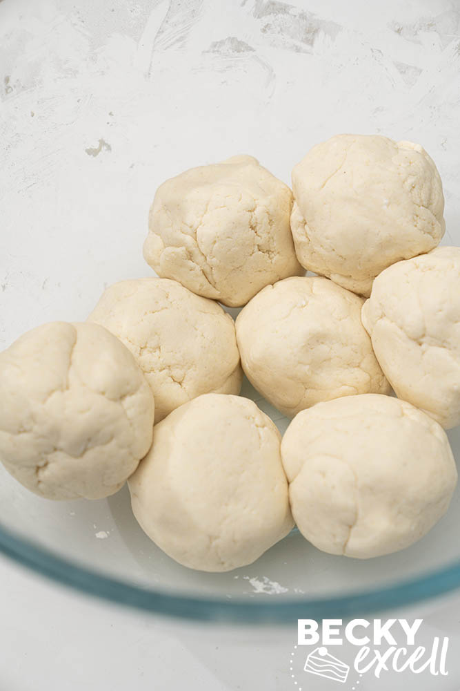 Dividing the 2-ingredient flatbread dough into 8 portions ready to roll