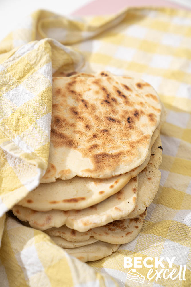 Keeping the flatbreads warm and moist wrapped in a tea towel/dish cloth