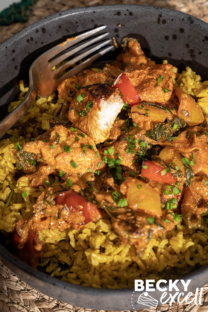 Juicy chicken breast with peppers, spinach and rice